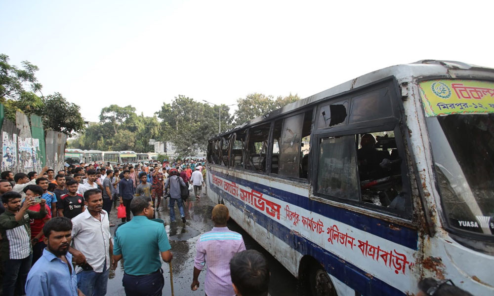 A bus was set on fire in Dhaka's Gulistan area on Monday, the second-day of the nationwide blockade called by BNP-Jamaat. The bus “Bikalpa Paribahan” was set on fire in front of Bangabandhu Square Hall Market at around 2:00pm. Photo : Reaz Ahmed Sumon