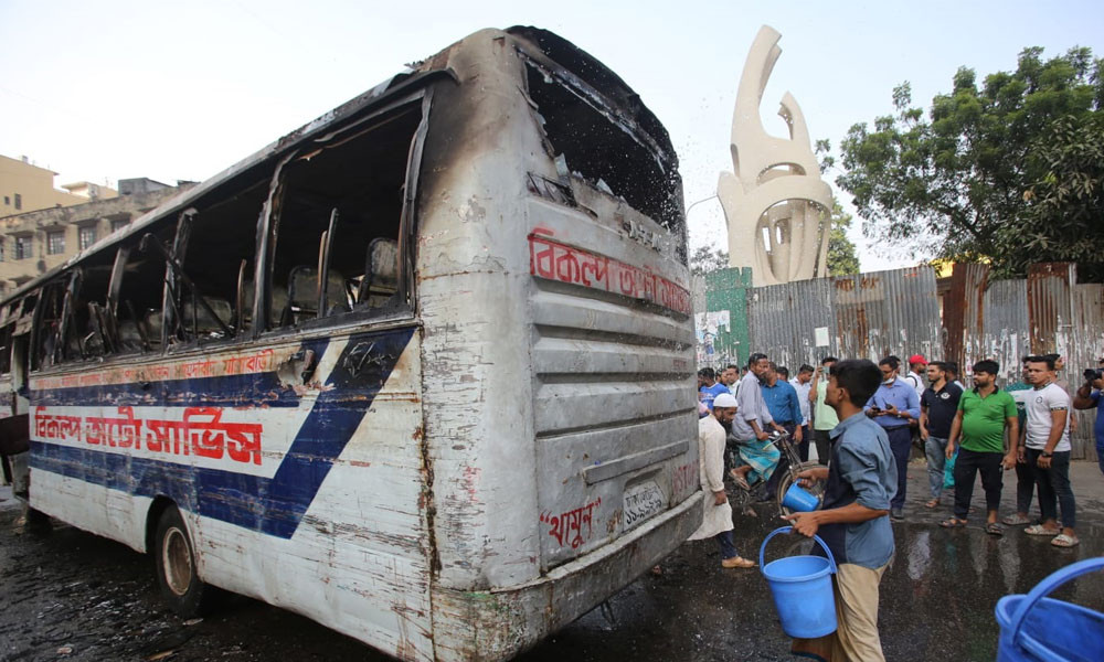 A bus was set on fire in Dhaka's Gulistan area on Monday, the second-day of the nationwide blockade called by BNP-Jamaat. The bus “Bikalpa Paribahan” was set on fire in front of Bangabandhu Square Hall Market at around 2:00pm. Photo : Reaz Ahmed Sumon