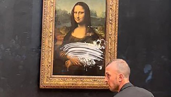 The 'Mona Lisa' has been caked in attempted vandalism stunt