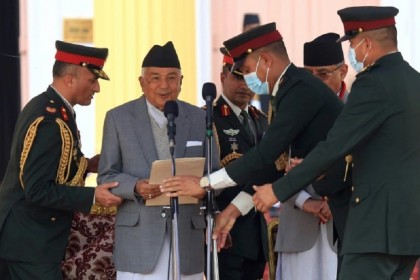 Nepal's new president sworn in as PM fights to stay in power