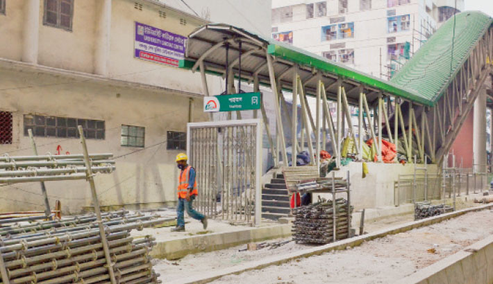 Walkway and staircase construction at the Shahbagh metro rail station is underway. The photo was taken on Tuesday. Muktadir Mokto