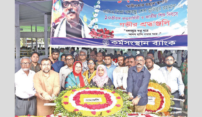 Karmasangsthan Bank officials pay tributes to Father of the Nation Bangabandhu Sheikh Mujibur Rahman by placing a wreath at the portrait of Bangabandhu at Dhanmondi Road no 32 in the capital on Sunday, marking his birth anniversary and National Children’s Day.