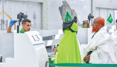 Bangladeshi pilgrims complete departure formalities at Hazrat Shahjalal International Airport on Sunday under the Route to Makkah Initiative, which allows them to finish most Hajj-related procedures—including immigration and luggage checks—before flying to Saudi Arabia. Photo: Saudi Embassy, Dhaka