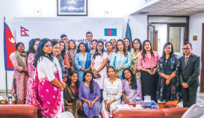 A visiting team of Nepalese female journalists exchange greetings with their Bangladeshi counterparts at the Embassy of Nepal in Dhaka on Sunday. -Daily sun Photo