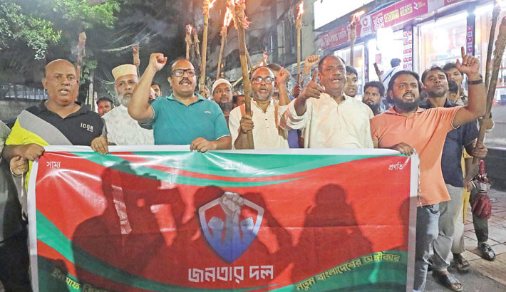 Leaders and activists of Janatar Dal march in a torch procession in the capital on Thursday, protesting attacks on the July uprising fighters. - DAILY SUN PHOTO