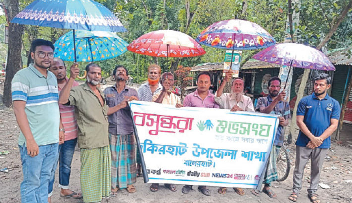 Umbrellas distributed among van drivers in Fakirhat