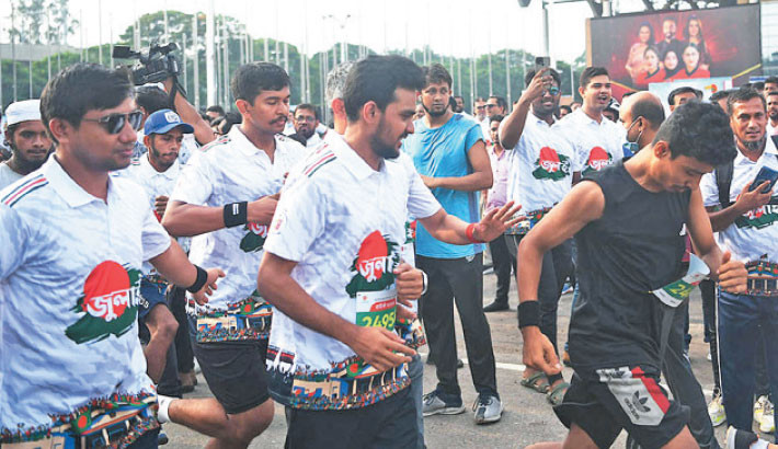 Youth and Sports Adviser Asif Mahmud Shoaib Bhuyain joins a five-kilometre symbolic marathon from the Bangladesh-China Friendship Conference Centre on Friday, marking the July-August mass uprising anniversary. -Daily Sun PHOTO