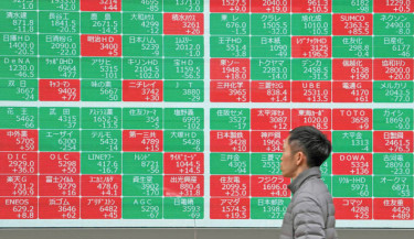 Asian stocks extend Wall St gains, 7-Eleven owner plunges