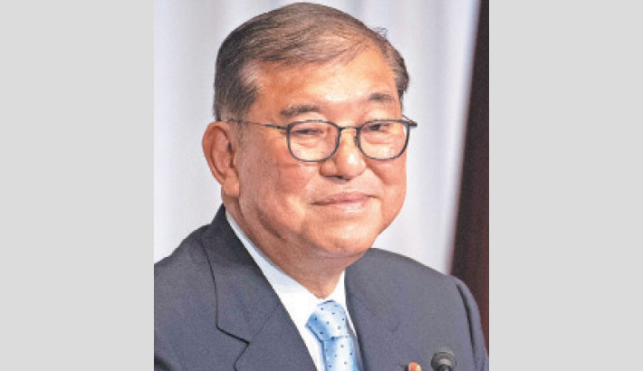 Japan PM hangs on after election debacle