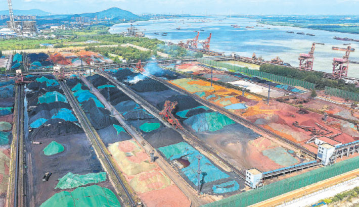 Piles of coal are seen at a coal yard beside the Yangtze River in Nanjing, in China’s eastern Jiangsu province on 22 July 2025. PHOTO: AFP