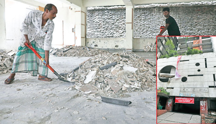 Workers clean the vandalised Awami League office in the capital’s Gulistan, which is set to be transformed into the International Fascism and Genocide Research Institute. The photo was taken on Thursday. -Daily Sun Photo