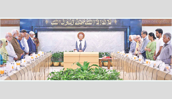 Chief Adviser Prof Muhammad Yunus and other advisers stand in solemn silence for one minute in remembrance of the jet crash victims during a Council of Advisers meeting at the Chief Adviser’s Office (CAO) in the capital on Thursday. -PID Photo