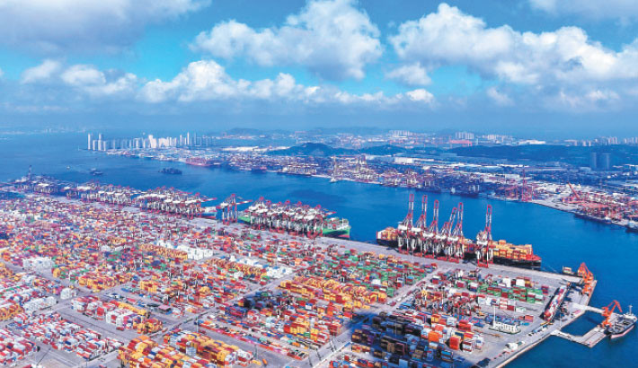 Containers and ships are seen at the port in Qingdao, in China’s eastern Shandong province on 25 July. PHOTO: AFP
