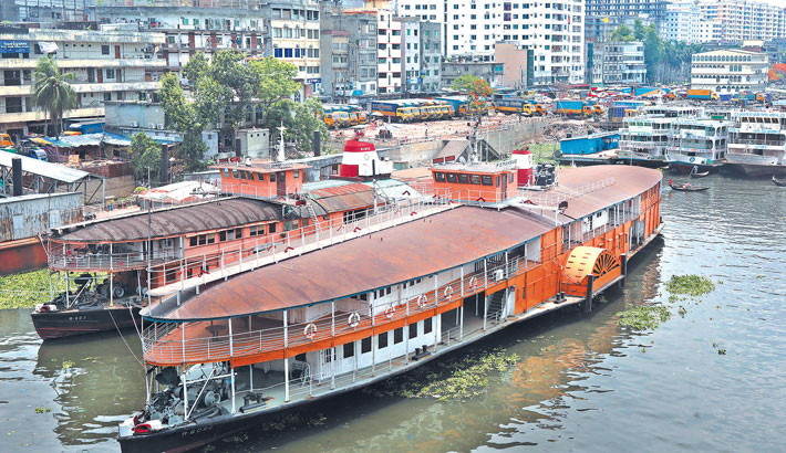 Two abandoned steamer rockets lie in the Buriganga River. Once operated by the Bangladesh Inland Water Transport Corporation, these vessels were the primary mode of transport between Dhaka and the southern region of the country. With time, demand for steamer rockets has dwindled, overtaken by the rise of launches and buses. Now, the era of steamer rockets is fading into oblivion. -Reaz Ahmed Sumon