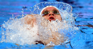 Marchand wins gold, day after world record