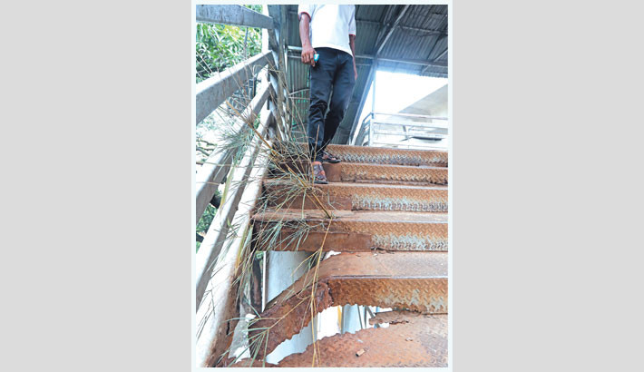 A broken iron stair of a footbridge in the capital’s Paribagh stands as a hazard for pedestrians, left unrepaired for long due to sheer negligence by the authorities. -Reaz Ahmed Sumon