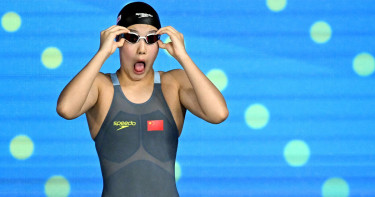 'Emotional' Yu, 12, celebrates historic world swimming medal