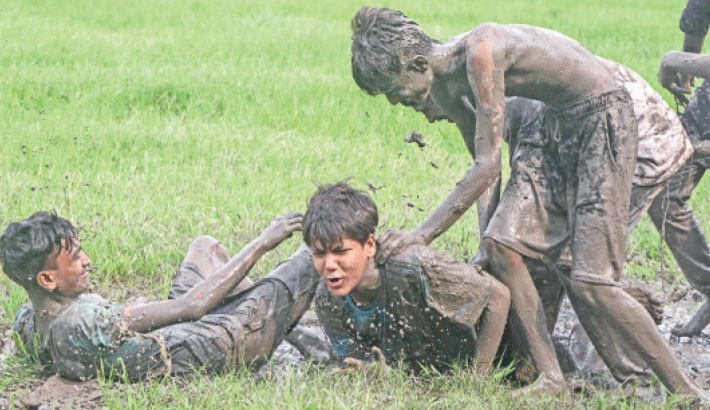 Youths play in the mud during a game of football at the Maidan, an urban park, in Kolkata, West Bengal, India on Sunday.

AFP PHOTO