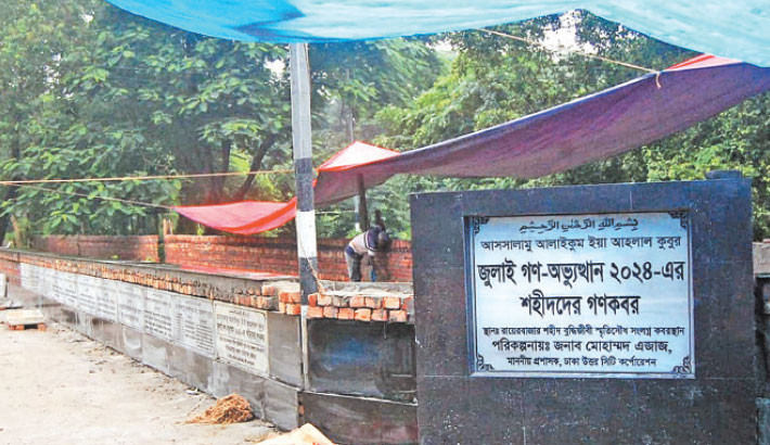 Renovation work is underway on the mass graves of the July martyrs at 
the Rayerbazar graveyard in the capital, marking the anniversary 
of the July uprising. The photo was taken on Monday.


-Focus bangla