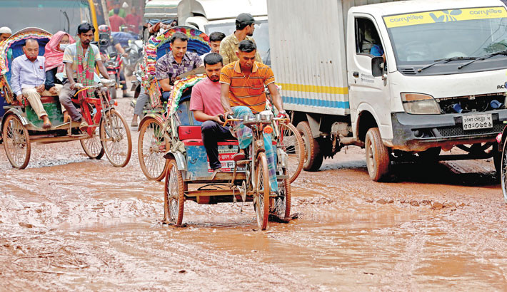 The already dilapidated 100-Feet Road in Notun Bazar under Bhatara Thana has further deteriorated following days of continuous rain. The damaged road often causes accidents. Photo taken on Thursday. -Kamrul Islam Ratan