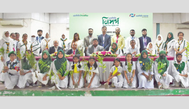 NCC Bank launches a month-long nationwide tree plantation campaign titled “NCC Nisorgo”, under the slogan “Apner Sathay Sobujer Pothay” (Towards a Greener Future with You). Shamsul Arefin, managing director of the bank, attended the launching event of the campaign at Kallyanpur Girls School and College in the capital.  Photo: Courtesy