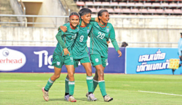 Bangladesh under-20 women’s team’s forward Sree Moti Trishna Rani (No. 9) celebrates the first goal against Korea Republic with Mst Sagorika (No. 10) and Shanti Mardi in Laos’ Vientiane on Sunday. -BFF PHOTO
