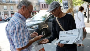 France's last newspaper hawker to receive national honour  from President Macron