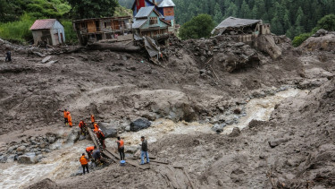 Indian rescuers scour debris after 60 killed in flood