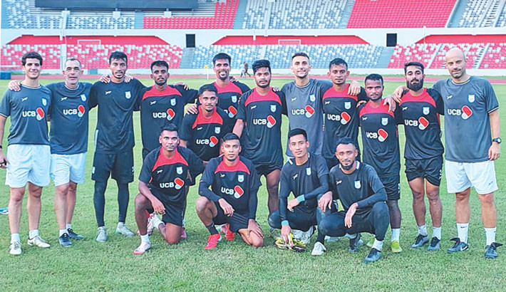 Bangladesh captain Jamal Bhuyan and head coach Javier Cabrera pose with other members of the team after Friday’s training session at Dhaka’s National Stadium ahead of the two friendlies against Nepal.  -  BFF photo