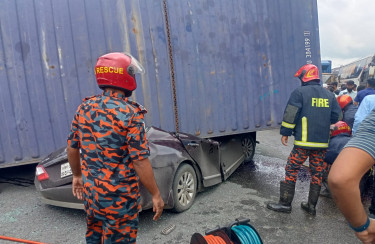 Four killed as covered van overturns onto private car in Cumilla