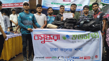 Bashundhara Shuvosangho stands beside freshers during admission process
