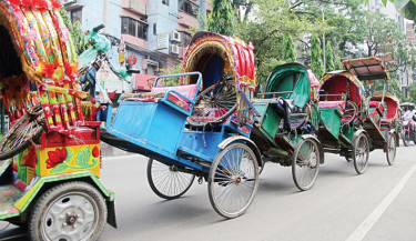 Battery-run autorickshaws seized for operating on highways are being taken for dumping as part of a police drive to enforce road safety. The photo was taken in the capital’s Mohammadpur area on Friday.  -  NAZMUL ISLAM