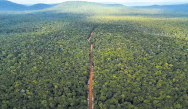 In Guyana, remote dirt road seen as future economic lifeline