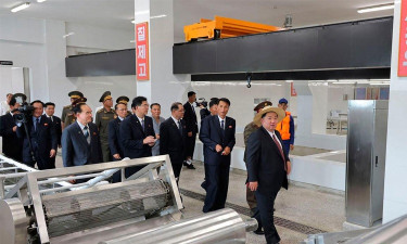 North Korea's Kim inspects new missiles before China trip