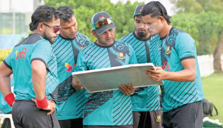 Bangladesh team chalk out their plans during the first training session at Sheikh Zayed Cricket Stadium in Abu Dhabi on Tuesday. 

TANVIN TAMIM
