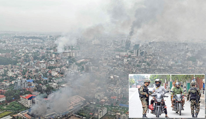 Plumes of smoke engulfs the city of Kathmandu on Wednesday, a day after several buildings were set ablaze by protesters. Inset, army personnel inspect identity proofs and documents of commuters along a street as part of security measures imposed in Kathmandu, Nepal on the day. - AFP PHOTO