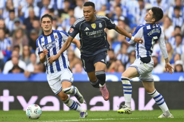 Mbappé leads 10-man Real Madrid to win at Sociedad