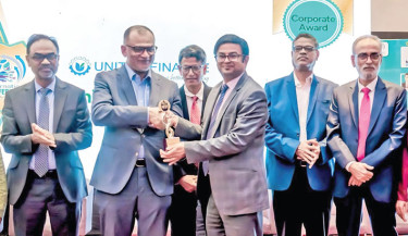 United Finance PLC receives Corporate Award in the Financing Category at the international conference titled “The Future of Business: Innovation, Technology and Sustainability,” hosted by the Bureau of Business Research, Faculty of Business Administration, University of Chittagong on Saturday. Commerce Adviser Sk Bashir Uddin hands over the award to United Finance Deputy Managing Director Mohammed Abul Ahsan. PHOTO: COURTESY