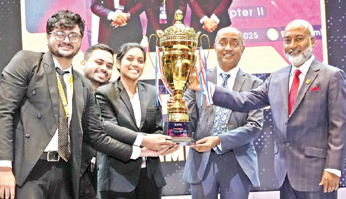 Attorney General Md Asaduzzaman presents a trophy to the winning team at the closing ceremony of the ‘BUP National Law Fest 2025’ at Shadhinota Auditorium in Bangladesh University of Professionals (BUP) on Sunday. -ISPR PHOTO