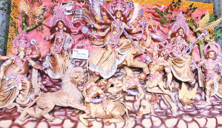 A Durga idol crafted entirely from jute is installed at the Uttar Murarikati Palpara Public Puja Mandap in Kalaroa Municipality of Satkhira. Four sculptors devoted three months to creating the idol, with a total expenditure of 
around Tk3 crore. 

Daily Sun Photo