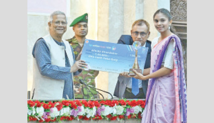Bangladesh women’s football team captain Afeida Khandaker receives the Youth Volunteer Award 2025 from Chief Adviser Dr. Muhammad Yunus at Shapla Hall, Chief Adviser’s Office, on Monday. -CAO Photo
