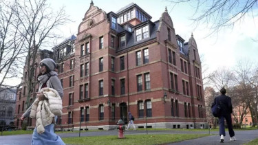 Trump admin places new restrictions on Harvard