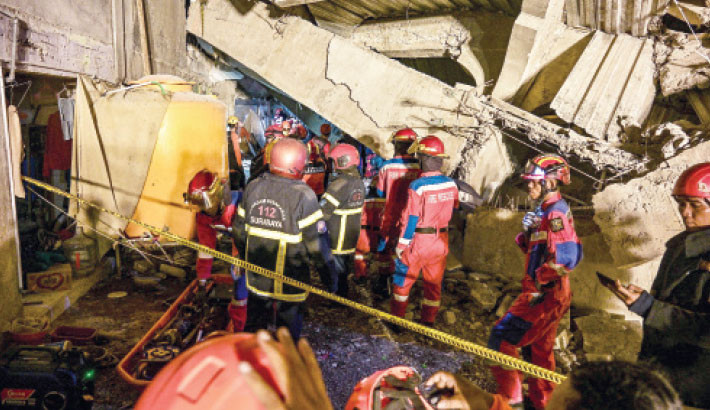3 dead, dozens trapped after Indonesian school collapses