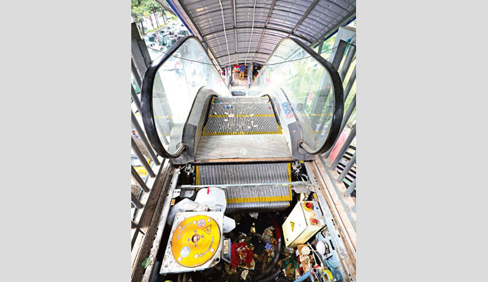 The elevator of the foot over bridge in front of Shaheed Suhrawardy Medical College & Hospital at Sher-e-Bangla Nagar in Dhaka lies useless as miscreants stole its machinery recently. The photo was taken on Saturday.  -  KAMRUL ISLAM RATAN