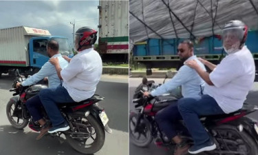 Adviser gets stuck in traffic jam, forced to ride motorbike