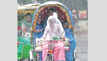 A battery-run auto rickshaw puller swathes himself in polythene, shielding against the monsoon’s lively gusts, while two children and their mother delight in the rain’s whimsical embrace in Dhaka University area on Wednesday. The active monsoon winds are driving the rainfall, with showers expected to continue over the coming days, the Bangladesh Meteorological Department forecasts. 	-NAZMUL ISLAM