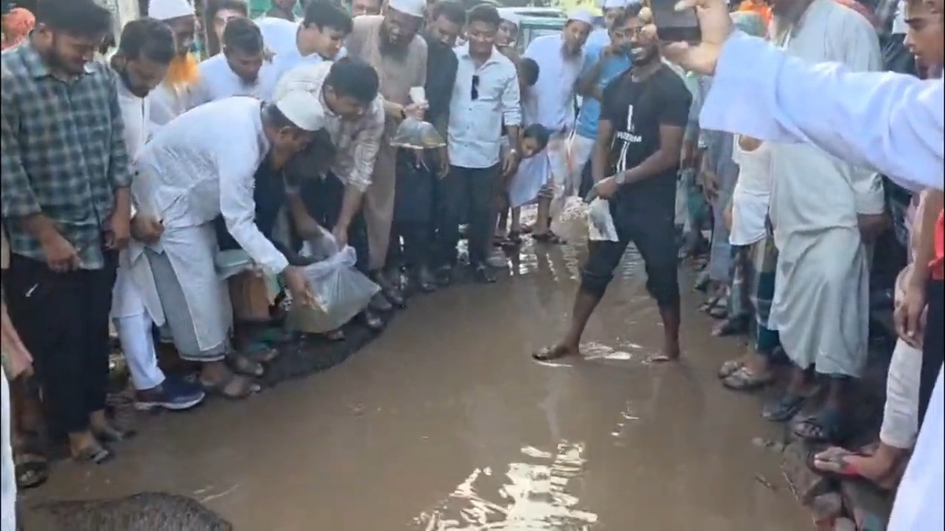 ‘If they can’t fix it, let’s fish it’: Hasnat’s protest on dilapidated Cumilla road