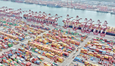Ships are berthed at the container terminal of the port in Qingdao, in China’s eastern Shandong province on 9 October 2025. US President Donald Trump announced an additional 100% tariff on China on 10 October and threatened to cancel a summit with Xi Jinping, reigniting his trade war with Beijing in a row over export curbs on rare earth minerals. Photo: AFP