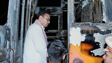A passenger bus in northern India catches fire and burns at least 20 people to death