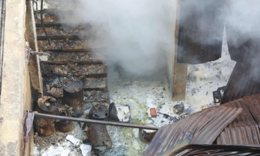 Smoke still billowing from burnt chemical godown
